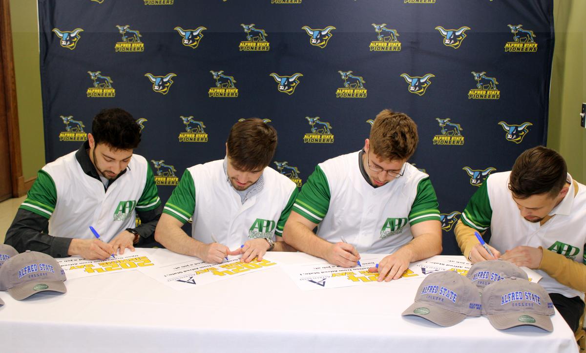 Students celebrate signing for their new jobs.