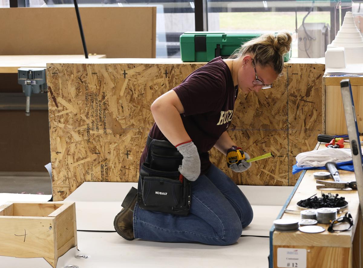 student competes in a roofing competition.