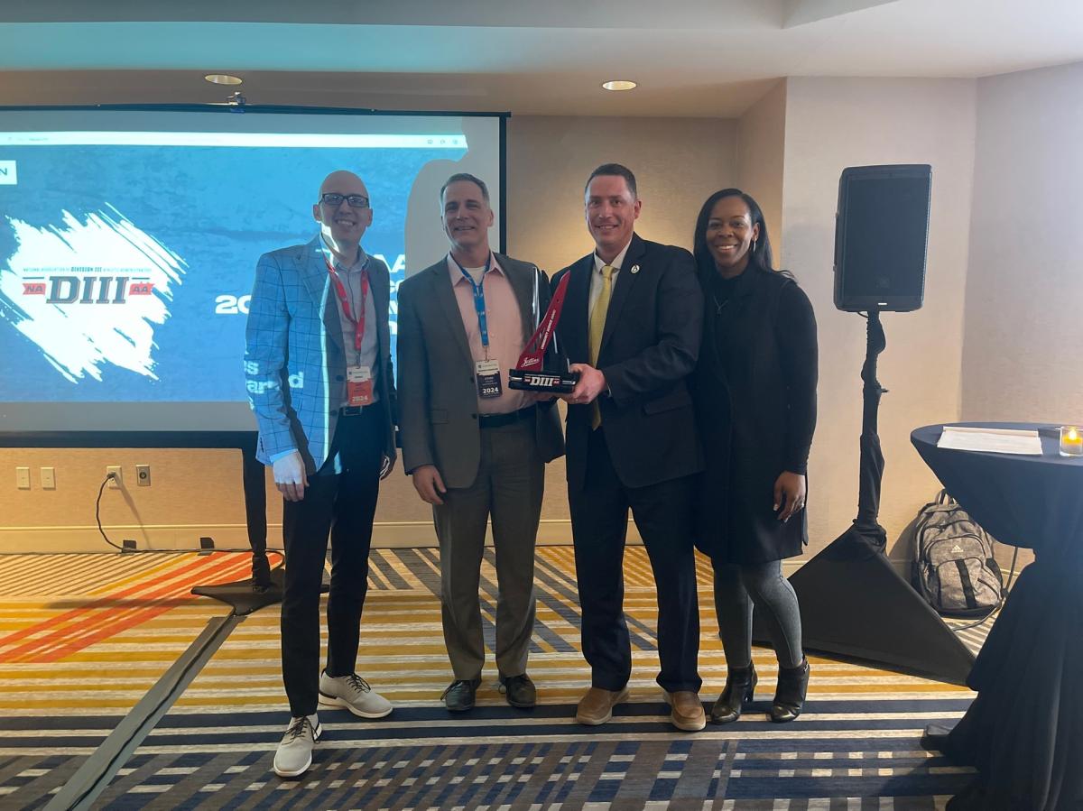 Dr. Mauro and Jason Doviak pose with award