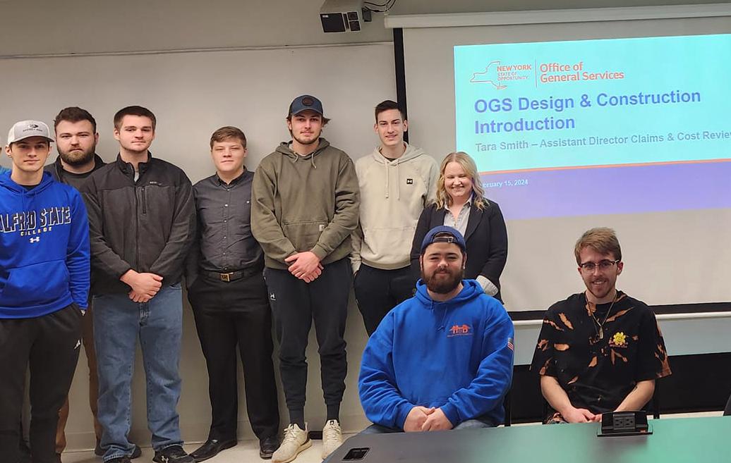 students with an alumni guest speaker in class