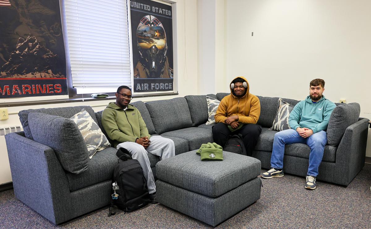 Veteran students sit on a couch