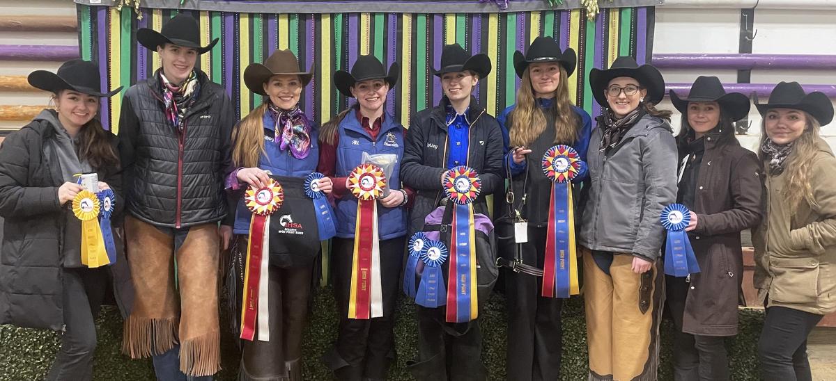 Members of the western equestrian team show off their awards