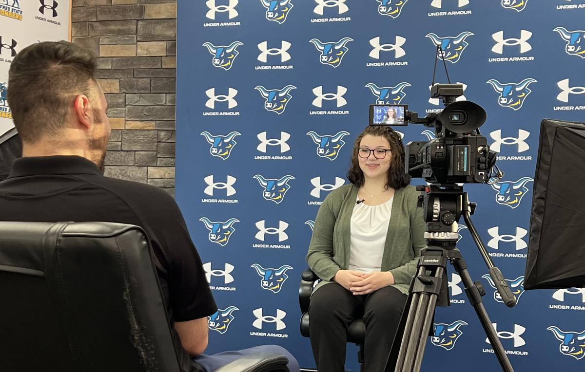 Alfred State wrestler being interviewed by WKBW