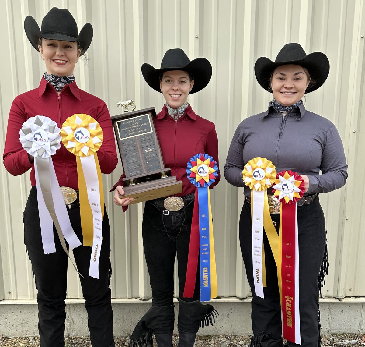 Alfred State riders Jessalyn Corson, Mikenna Riethmiller, and Molly Arnold show off their awards from the IHSA Western Regionals.