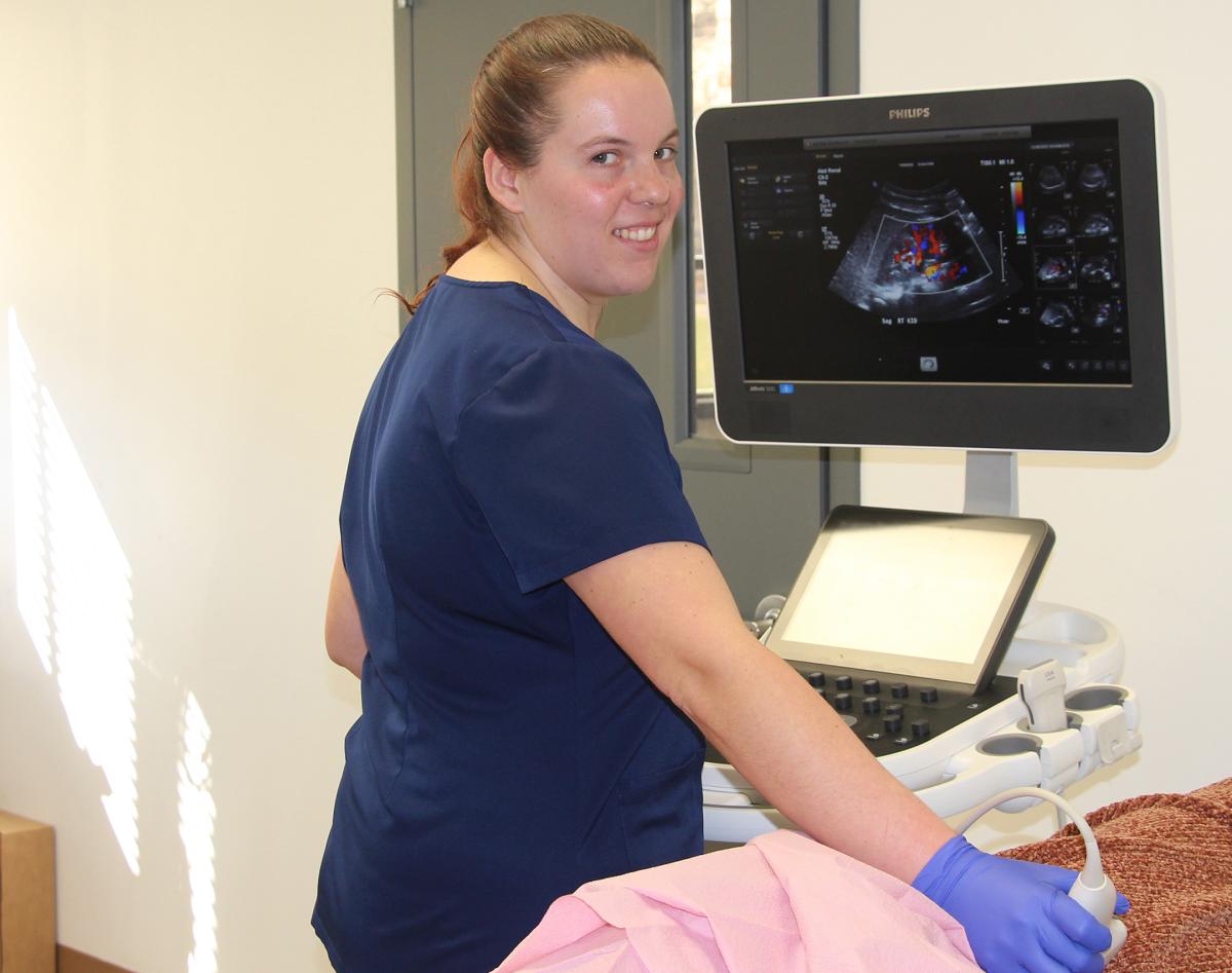 Student scans a patient.