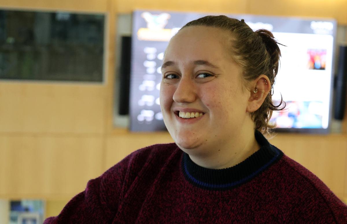 Student standing in Student Leadership Center