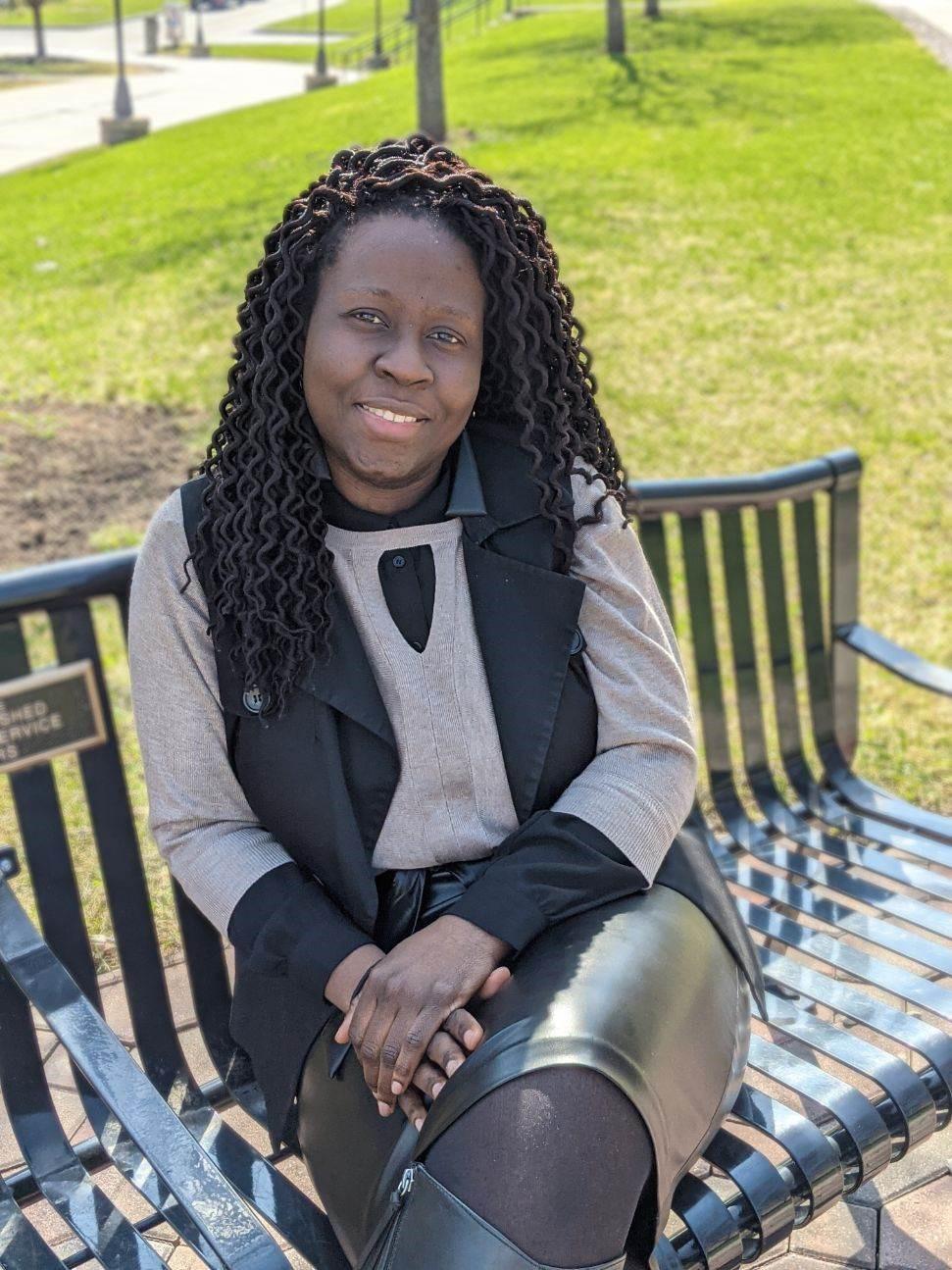 Afua Boahene sits outside on a nice day