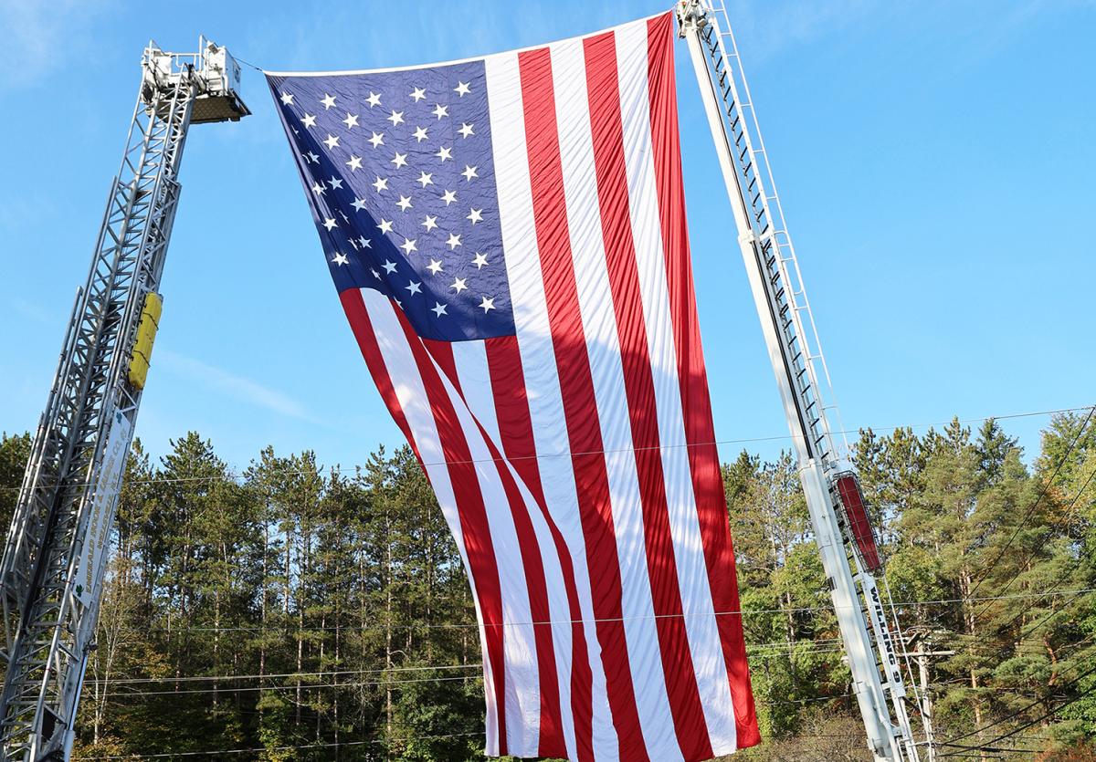 giant flag displayed on the Wellsville campus