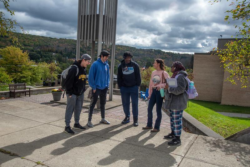 students in front of bell tower
