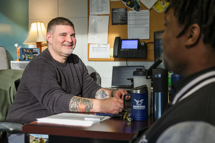 An advisor meeting with a student