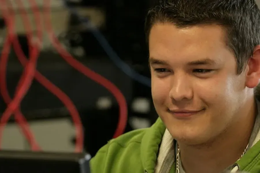 IT student working on computer.