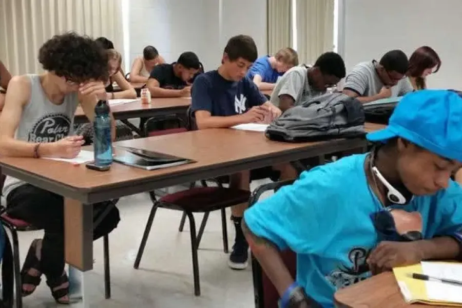 Students working on assignment in a classroom.