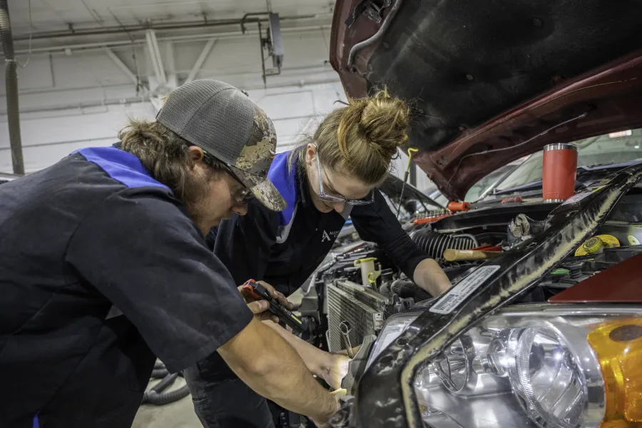 Photo of two students in the automotive trades.
