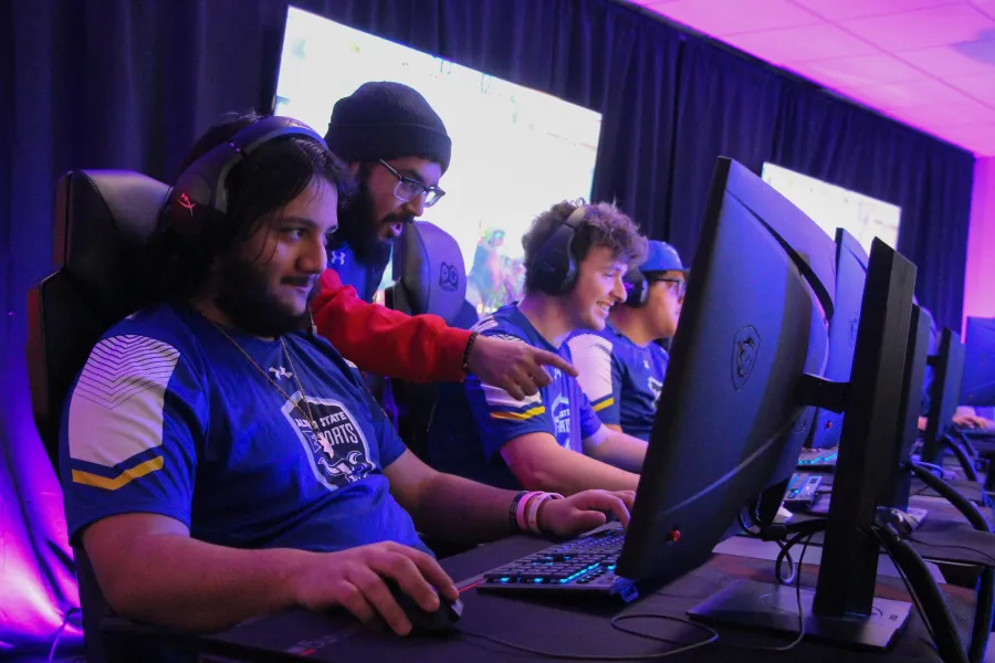 Students playing video games on computers.