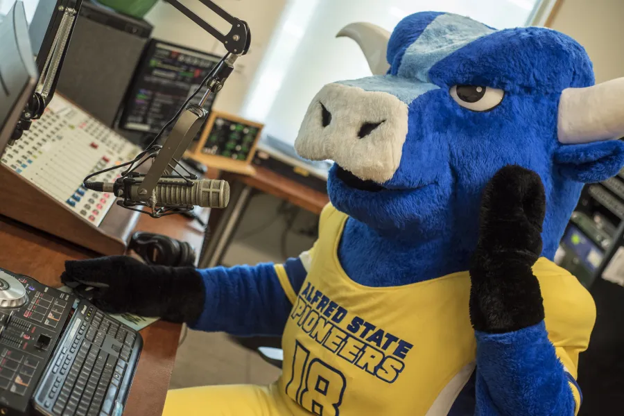 Alfred State's mascot in a recording studio