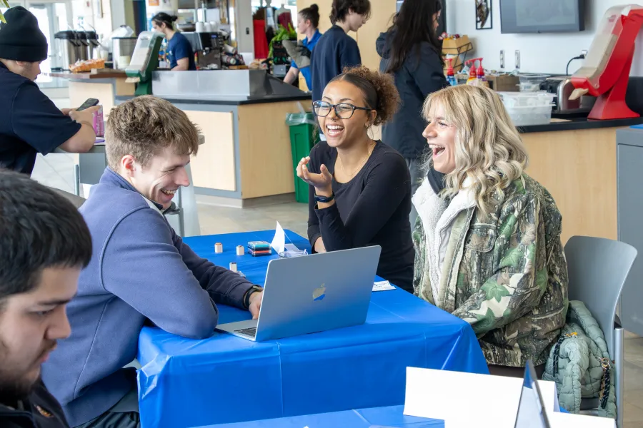 students with a laptop