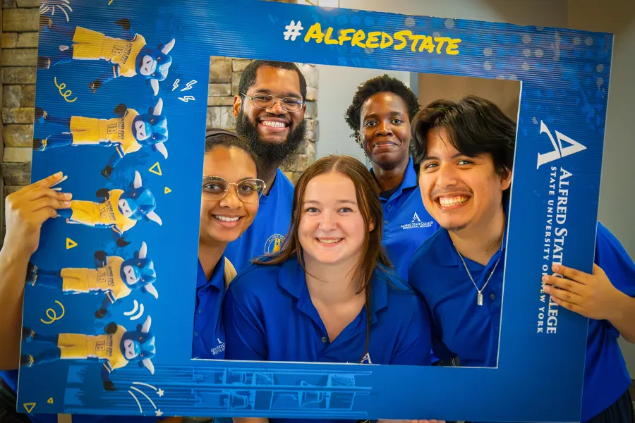 students holding a photo frame