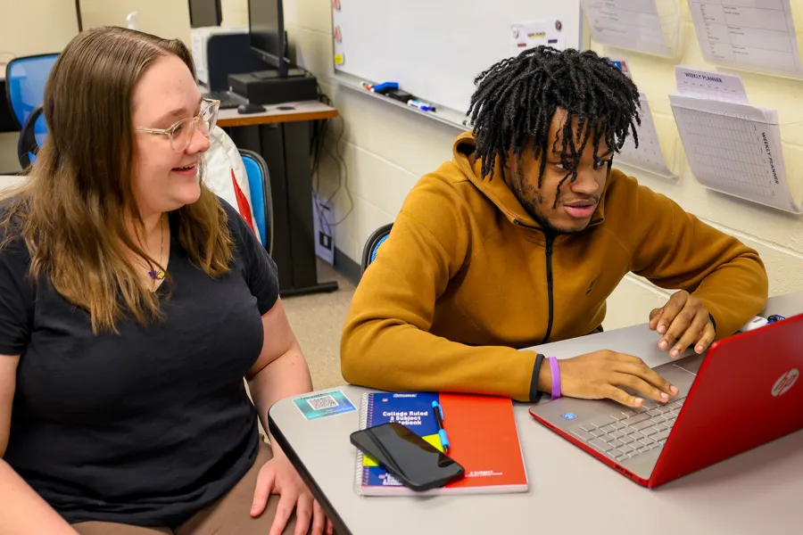 Tutor working with a student on science homework