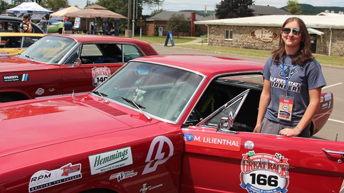Olivia Gadjo outside of her team’s 1966 Ford Mustang.