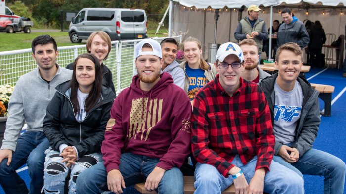 Alfred State graduates enjoy the End Zone Party at a past Homecoming/Family Weekend.