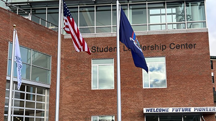 Flags at the front entrance to the Student Leadership Center 
