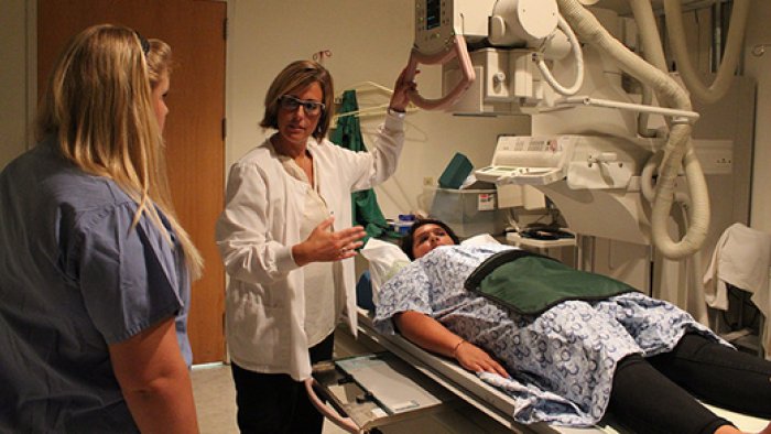 Students and instructor use medical imaging equipment