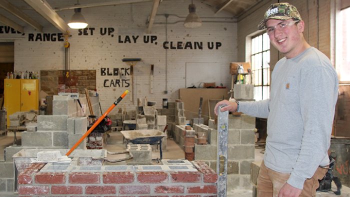 A masonry student works on a project at the School of Applied Technology. Masonry is one of several academic programs in the school ranked highly by US News &amp; World Report.