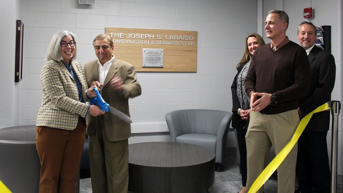 oseph Laraiso along with Erin Vitale, chair of the civil engineering technology department, cut the ribbon for the new lab. ASC President Steven Mauro, Executive Director of Institutional Advancement Danielle White, and Dean of the School of Architecture, Management, and Engineering Technology watch on.