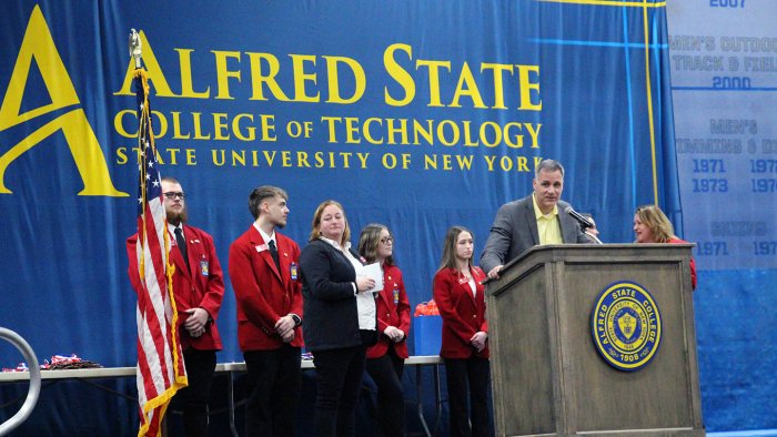 Alfred State President Dr. Steven Mauro speaks with the students that competed during the 34th annual Skills USA competition during the awards ceremony.