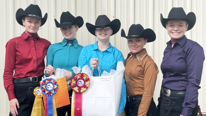 Members of the Alfred State western equestrian team display their awards from their season opening competition.