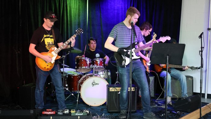 Students practice in the new Rock Band room