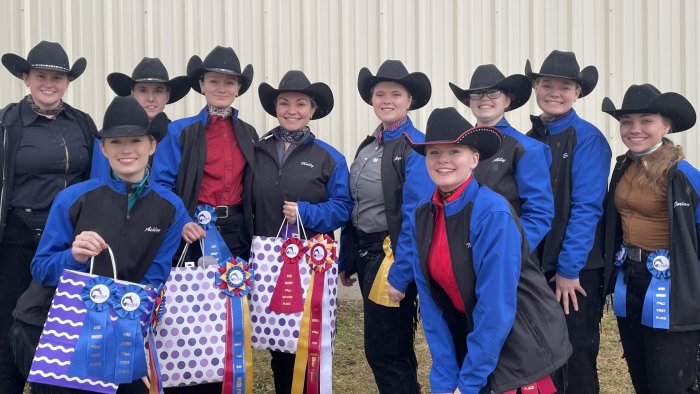 The western equestrian team poses for a team picture following a show