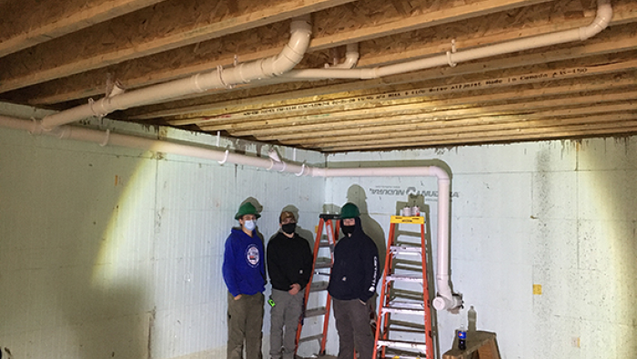 HVAC students assist with plumbing