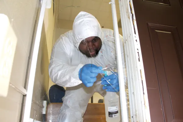 A student swapping a mock-crime scene