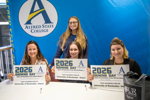 A trio of Alfred State students sign to commemorate the beginning of their careers at the University of Rochester – Noyes Health.