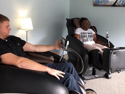 Students use massage chairs