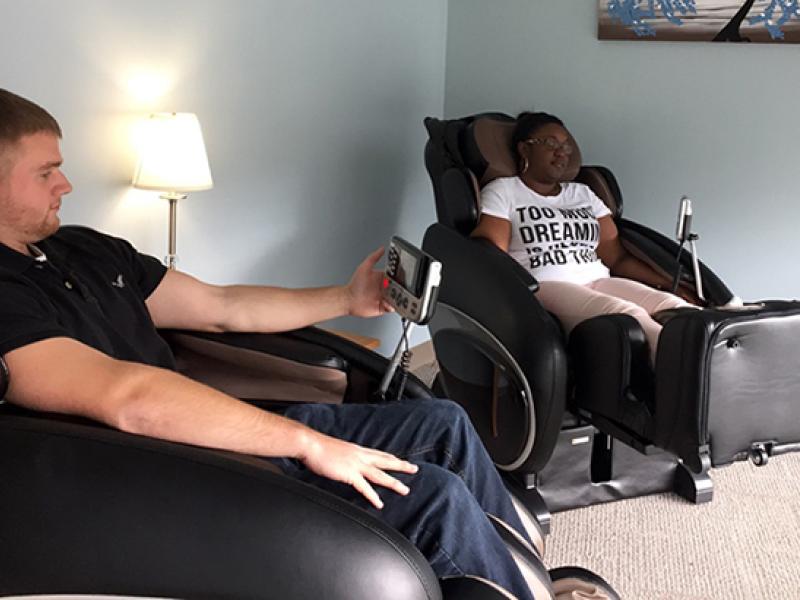 Students use massage chairs