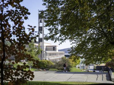 Hinkle Bell Tower through the trees near the Engineering Science Building