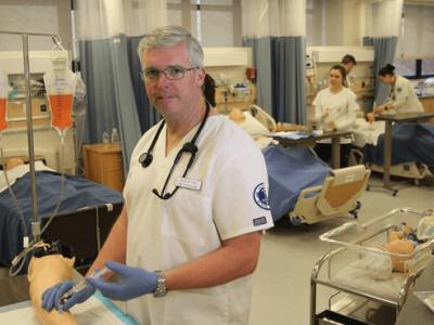 male student in a nursing lab