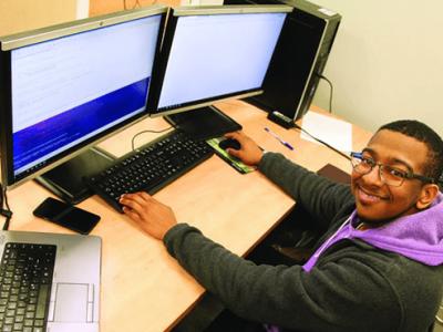 Juwan Gross in front of a computer