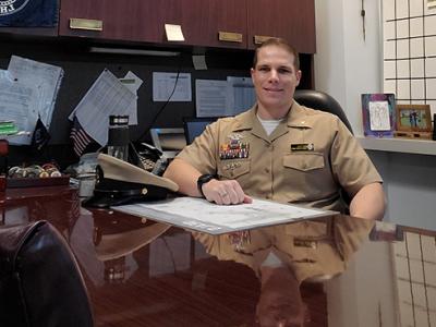 Max sitting at his desk