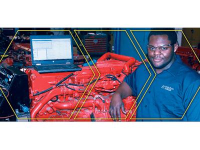 Nizair Evans in a lab with auto equipment