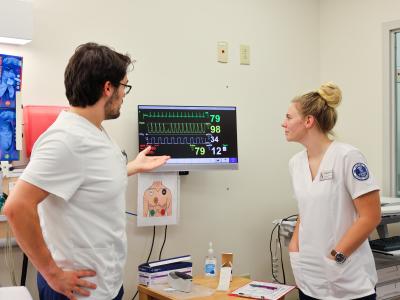 Students work in a nursing simulation lab