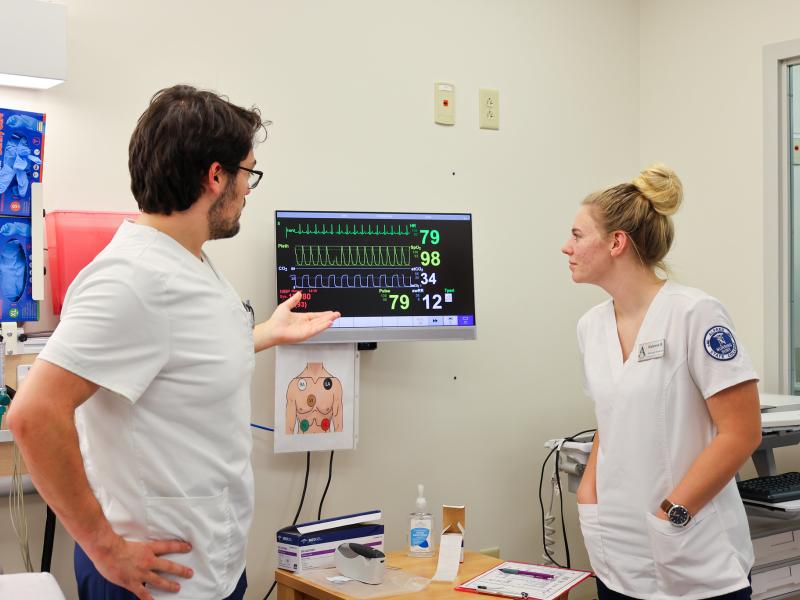 Students work in a nursing simulation lab