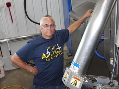 Phil Schroeder works with the automated milking system
