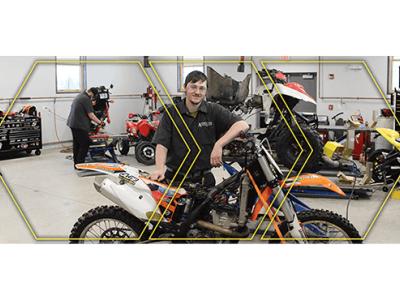 Seth Cooney by dirt bike in lab.