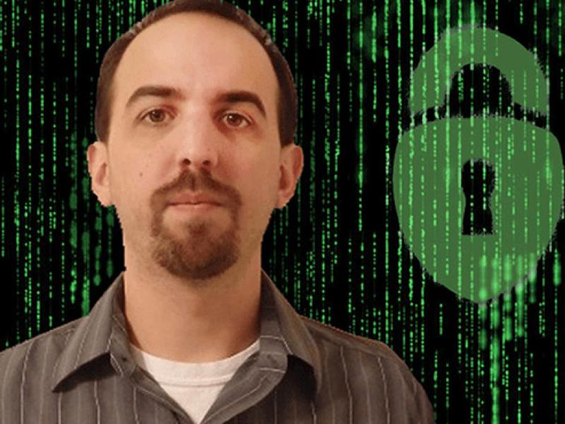 Thomas Richards with green bionary numbers and image of a lock next to him