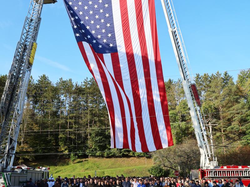 Large flag on the Wellsville campus