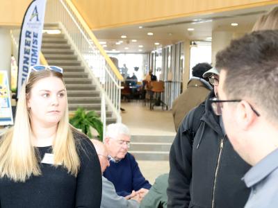 Allison DeGraff listens to students during a presentation