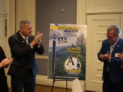 Dr. Mauro celebrates the unveiling of the comprehensive campaign progress.